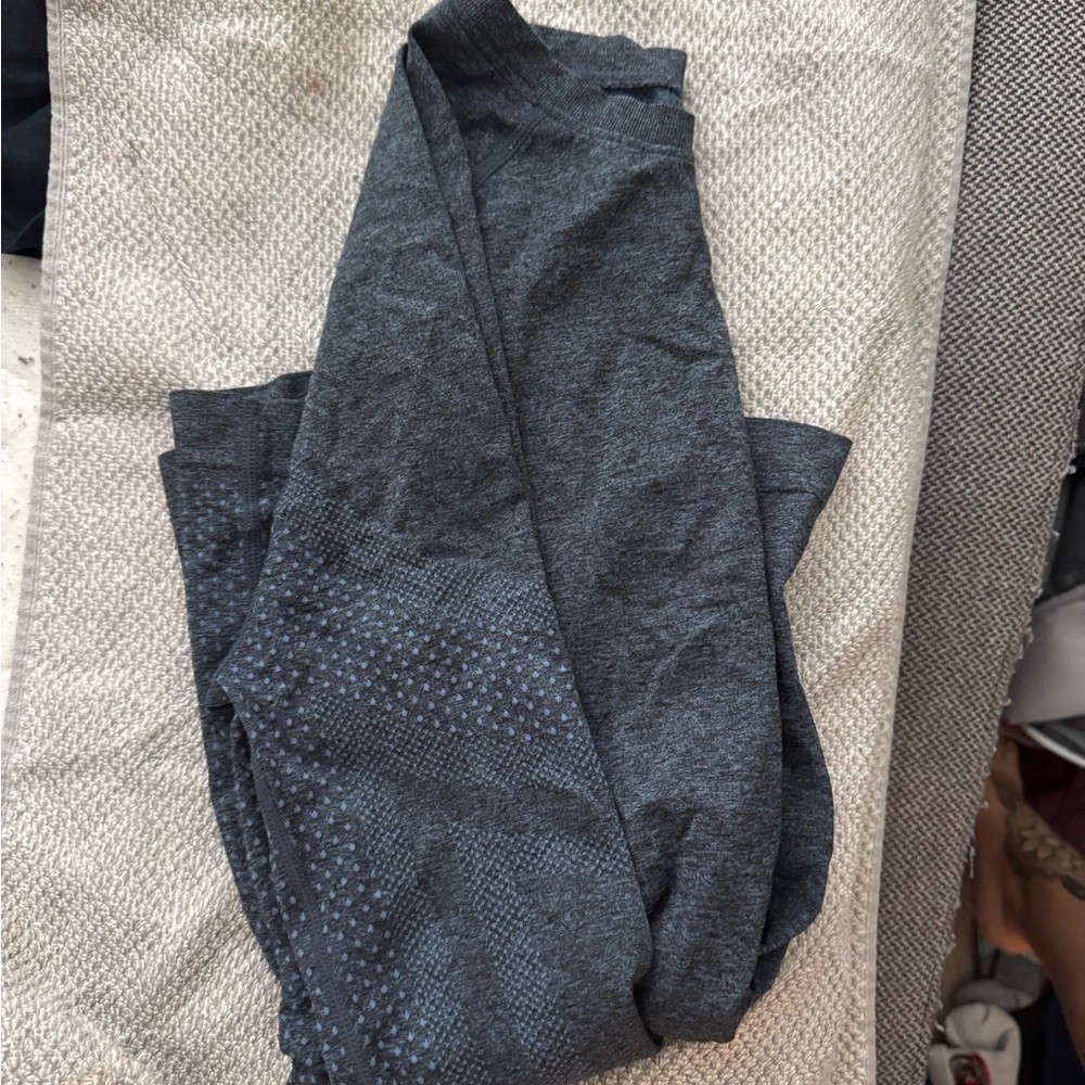 Figs under scrub shirt. It's a grayish blue color.